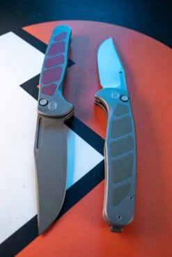 LuvThemKnives Rezult Button Lock, Finger Flicker & Flipper Pocket Knife Titanium Handle Burgundy G10 Inlay 20CV Steel LTK-609-1 -White Mountain Knives Shop DSC0796 66336.1691170664